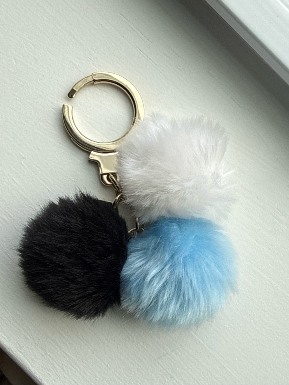 Kate spade Gold Keyring Pom Pom Charm with Blue, White and Black Fur Balls